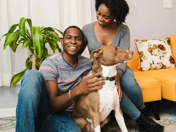 Young couple with dog - #1 Home Buying Realtors in Seattle